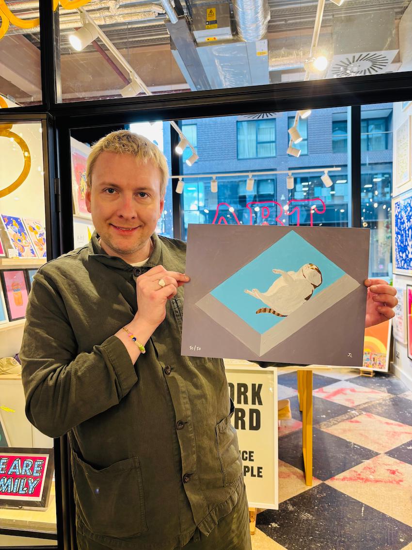 A cat having a little think while resting on a skylight on a hot summer's day - 2025 Re-edition